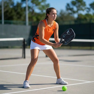 KOBO Gecko tank top orange and tsunami paddle on the court