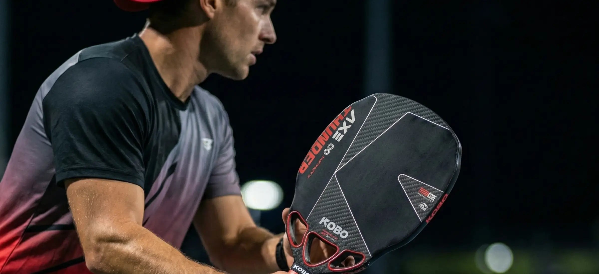 Player is holding a Thunder AXE pickleball paddle